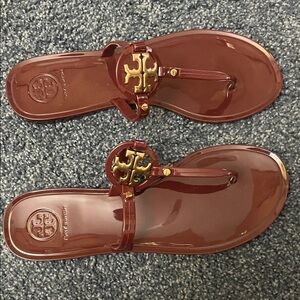 Tory Burch burgundy jelly sandal.